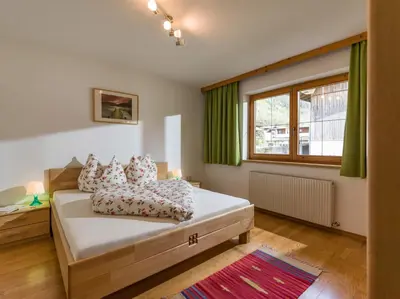 Ein Bett oder Betten in einem Zimmer der Unterkunft Ferienwohnung Huber