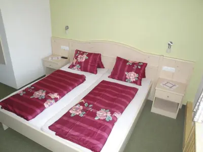 Ein Bett oder Betten in einem Zimmer der Unterkunft Bio Angererhof