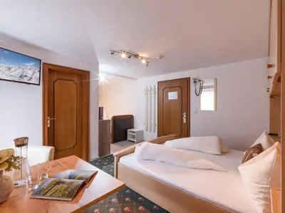 Ein Bett oder Betten in einem Zimmer der Unterkunft Hotel Hubertus