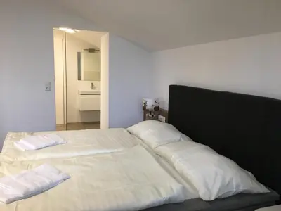 Ein Bett oder Betten in einem Zimmer der Unterkunft Unterbachblick