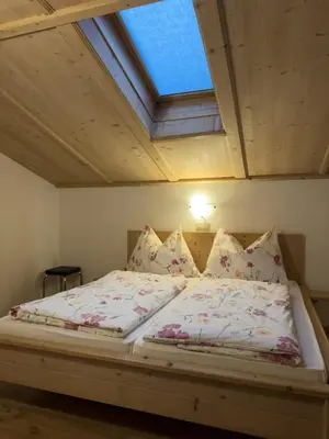 Ein Bett oder Betten in einem Zimmer der Unterkunft Aussermooserhof