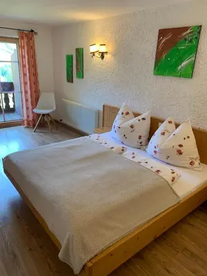 Ein Bett oder Betten in einem Zimmer der Unterkunft Aussermooserhof