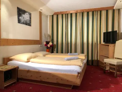 Ein Bett oder Betten in einem Zimmer der Unterkunft Ferienhof Kampfl