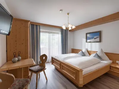 Ein Bett oder Betten in einem Zimmer der Unterkunft Landhaus Alpenherz