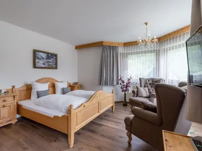 Ein Bett oder Betten in einem Zimmer der Unterkunft Landhaus Alpenherz