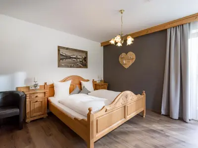Ein Bett oder Betten in einem Zimmer der Unterkunft Landhaus Alpenherz