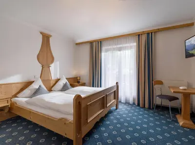 Ein Bett oder Betten in einem Zimmer der Unterkunft Landhaus Alpenherz