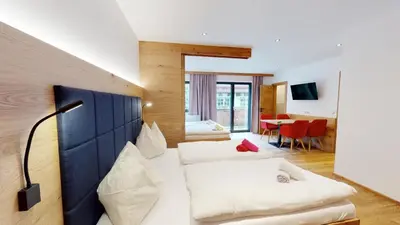 Ein Bett oder Betten in einem Zimmer der Unterkunft Pension Lederergütl - Jokercard & Parkplatz inkl