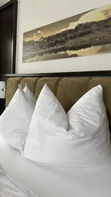 Ein Bett oder Betten in einem Zimmer der Unterkunft Hotel Dorfgasthof Schlösslstube