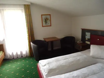 Ein Bett oder Betten in einem Zimmer der Unterkunft Hotel Dorfgasthof Schlösslstube
