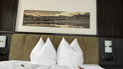 Ein Bett oder Betten in einem Zimmer der Unterkunft Hotel Dorfgasthof Schlösslstube