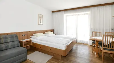 Ein Bett oder Betten in einem Zimmer der Unterkunft Gästehaus Luise