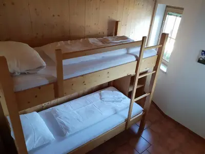 Ein Bett oder Betten in einem Zimmer der Unterkunft Chalet Bergzauber by PiaundDirk