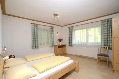 Ein Bett oder Betten in einem Zimmer der Unterkunft Chalet Bergzauber by PiaundDirk