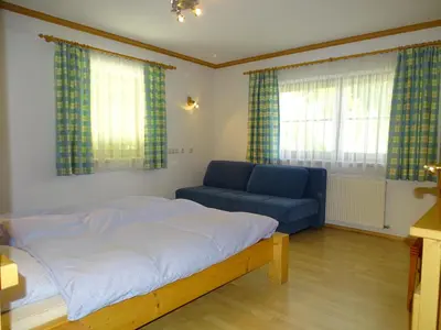 Ein Bett oder Betten in einem Zimmer der Unterkunft Chalet Bergzauber by PiaundDirk