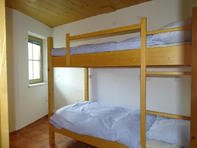 Ein Bett oder Betten in einem Zimmer der Unterkunft Chalet Bergzauber by PiaundDirk