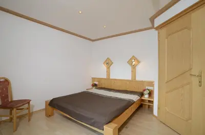 Ein Bett oder Betten in einem Zimmer der Unterkunft Chalet Bergzauber by PiaundDirk