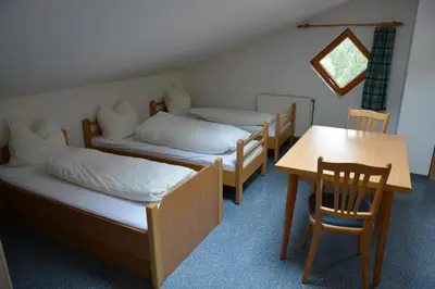 Ein Bett oder Betten in einem Zimmer der Unterkunft Ski In-Ski Out - Gästehäuser Saalbach-Hinterglemm - Wallegghof Christianhof