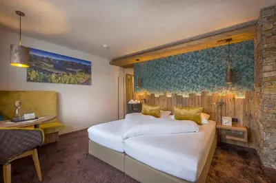 Ein Bett oder Betten in einem Zimmer der Unterkunft Liebes Caroline 4-Sterne-Hotel