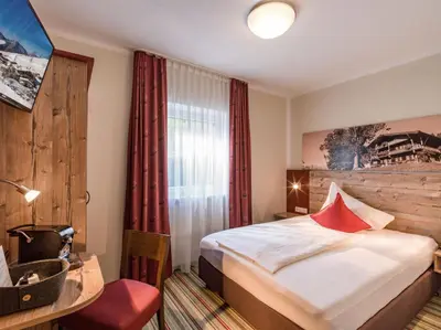 Ein Bett oder Betten in einem Zimmer der Unterkunft Alpengasthof Gruberhof