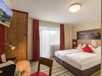Ein Bett oder Betten in einem Zimmer der Unterkunft Alpengasthof Gruberhof