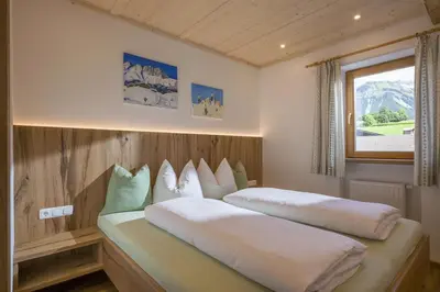 Ein Bett oder Betten in einem Zimmer der Unterkunft Appartement Hinterholzer