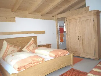 Ein Bett oder Betten in einem Zimmer der Unterkunft Chalet Der Tyroler Adler im Zentrum vom Wilden Kaiser