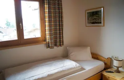 Ein Bett oder Betten in einem Zimmer der Unterkunft Pension Hohe Salve