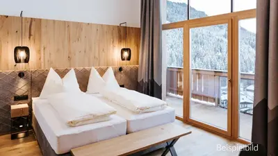 Ein Bett oder Betten in einem Zimmer der Unterkunft Hotel Thurnerhof