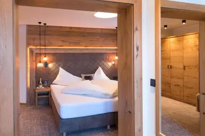 Ein Bett oder Betten in einem Zimmer der Unterkunft Der Berghof