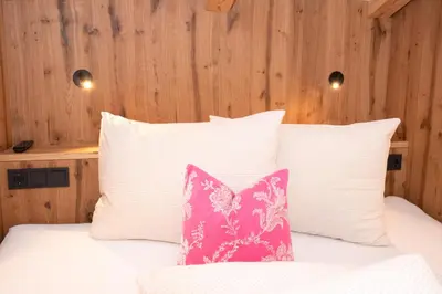 Ein Bett oder Betten in einem Zimmer der Unterkunft Der Berghof