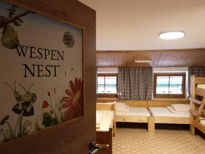 Ein Bett oder Betten in einem Zimmer der Unterkunft Ferienheim Riedhof