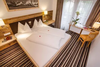 Ein Bett oder Betten in einem Zimmer der Unterkunft Gasthof zum Wilden Kaiser