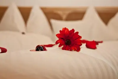 Ein Bett oder Betten in einem Zimmer der Unterkunft Gasthof zum Wilden Kaiser