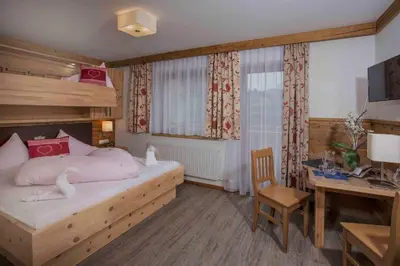 Ein Bett oder Betten in einem Zimmer der Unterkunft Gasthof zum Wilden Kaiser