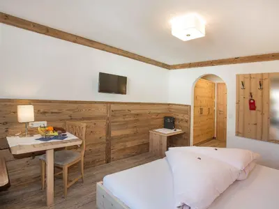 Ein Bett oder Betten in einem Zimmer der Unterkunft Gasthof zum Wilden Kaiser