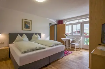Ein Bett oder Betten in einem Zimmer der Unterkunft Apparthotel Tom Sojer