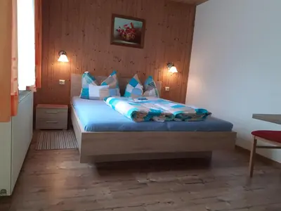 Ein Bett oder Betten in einem Zimmer der Unterkunft Gästehaus Birkenheim