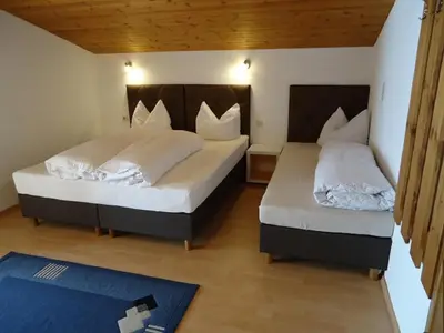 Ein Bett oder Betten in einem Zimmer der Unterkunft Gästehaus Birkenheim