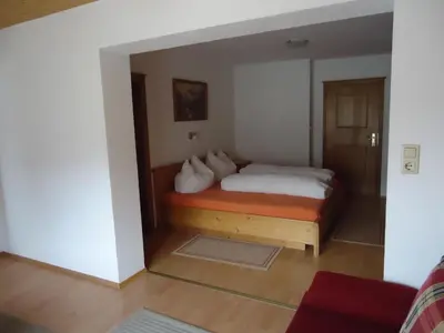 Ein Bett oder Betten in einem Zimmer der Unterkunft Gästehaus Birkenheim