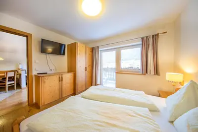 Ein Bett oder Betten in einem Zimmer der Unterkunft Apartmenthaus Berndlalm