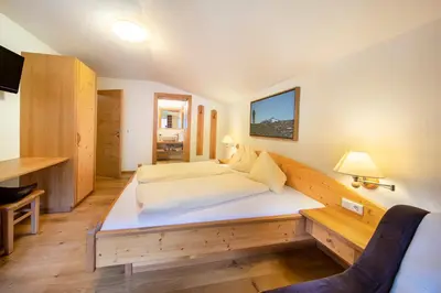 Ein Bett oder Betten in einem Zimmer der Unterkunft Apartmenthaus Berndlalm