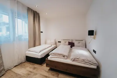 Ein Bett oder Betten in einem Zimmer der Unterkunft Apartklusiv Kaltenbach