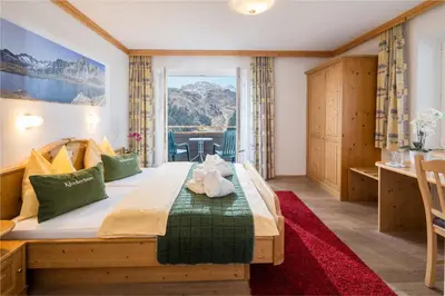 Ein Bett oder Betten in einem Zimmer der Unterkunft Gästehaus Edelweiss