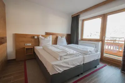 Ein Bett oder Betten in einem Zimmer der Unterkunft Appartementhaus Spiegl by Travel Partner