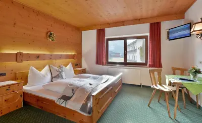 Ein Bett oder Betten in einem Zimmer der Unterkunft Pension Hüttwirt