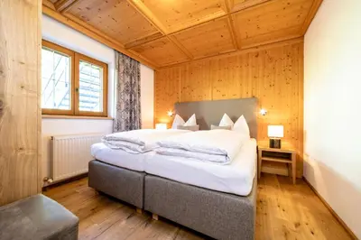 Ein Bett oder Betten in einem Zimmer der Unterkunft Gästehaus Gratlspitz