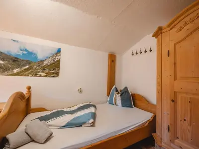 Ein Bett oder Betten in einem Zimmer der Unterkunft Holiday Home Alte Sahnealm by Interhome