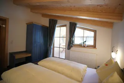 Ein Bett oder Betten in einem Zimmer der Unterkunft Dorfappartements Söll