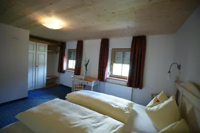 Ein Bett oder Betten in einem Zimmer der Unterkunft Dorfappartements Söll